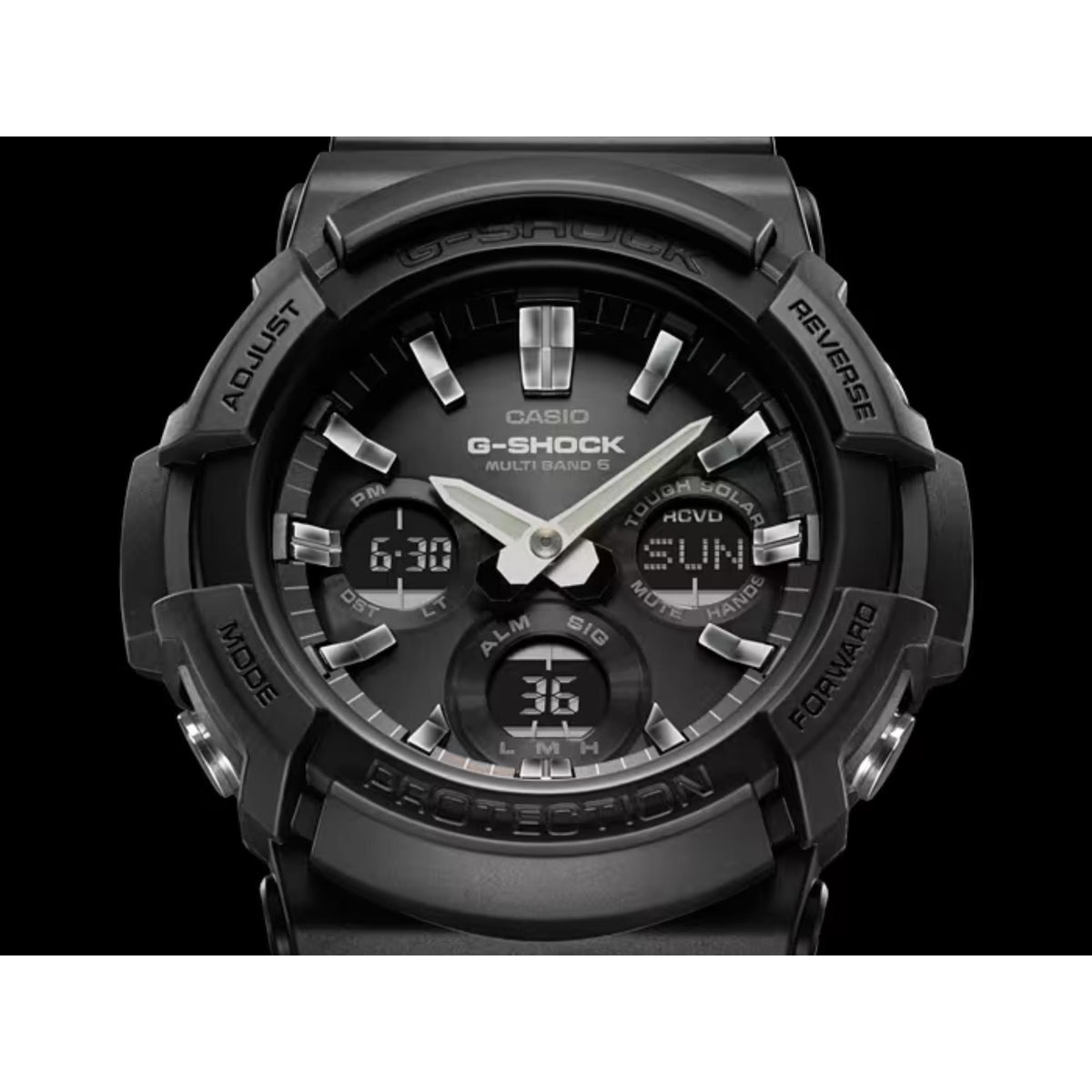 Close-up of black G-Shock dial with silver hands, hour markers, and digital display