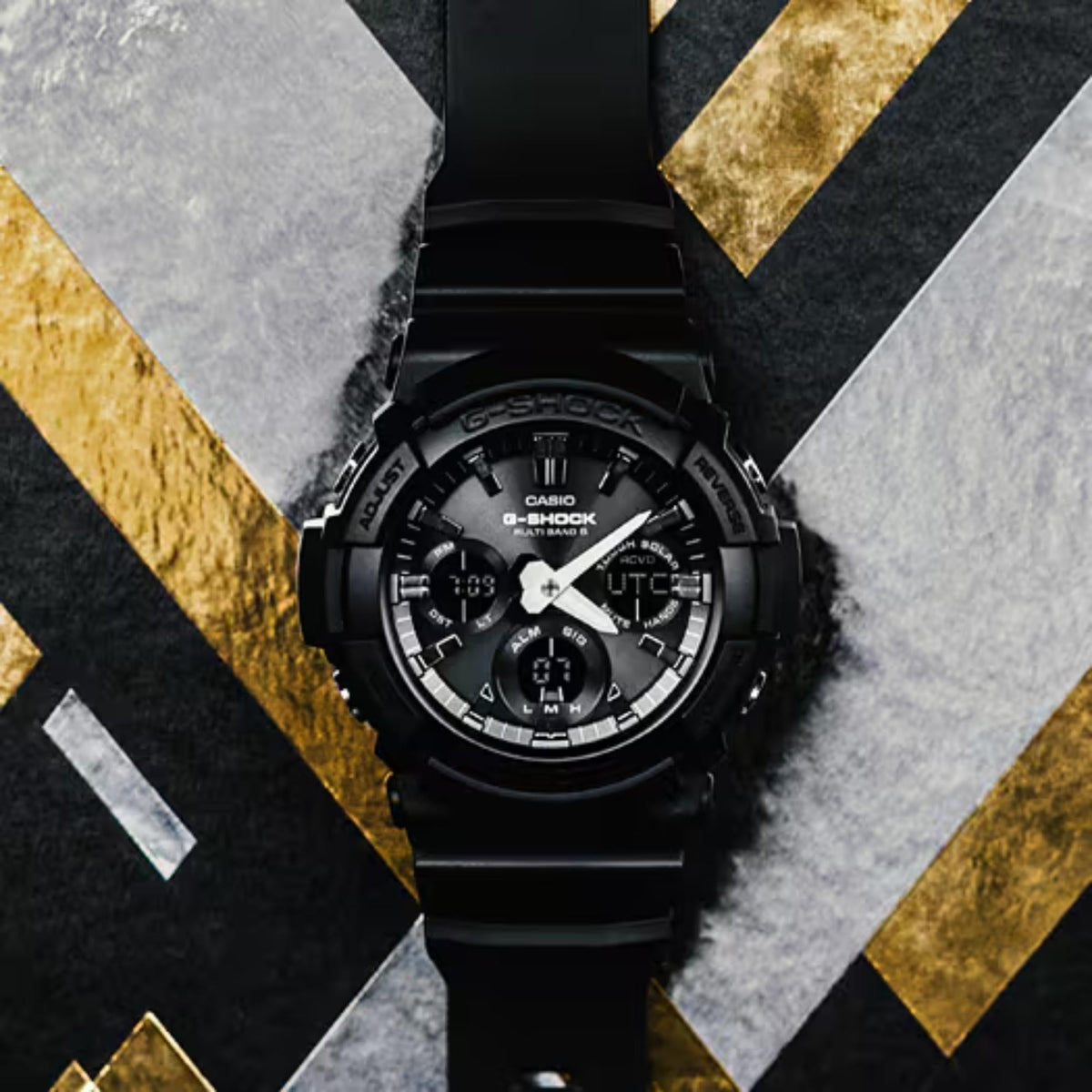 Black G-Shock watch with analog hands, digital subdials, and UTC on the dial