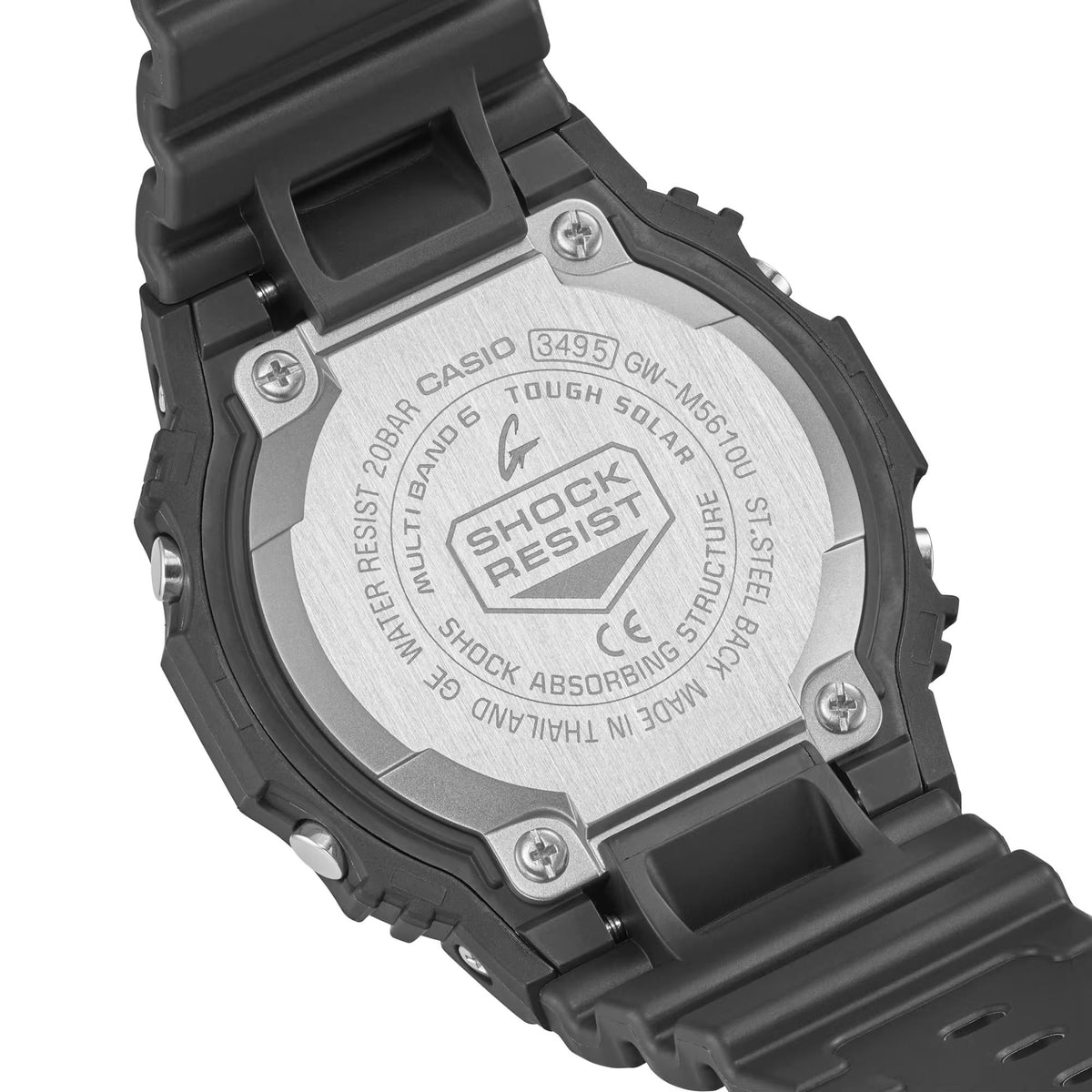 Steel case back of black G-Shock digital watch with screws and printed markings