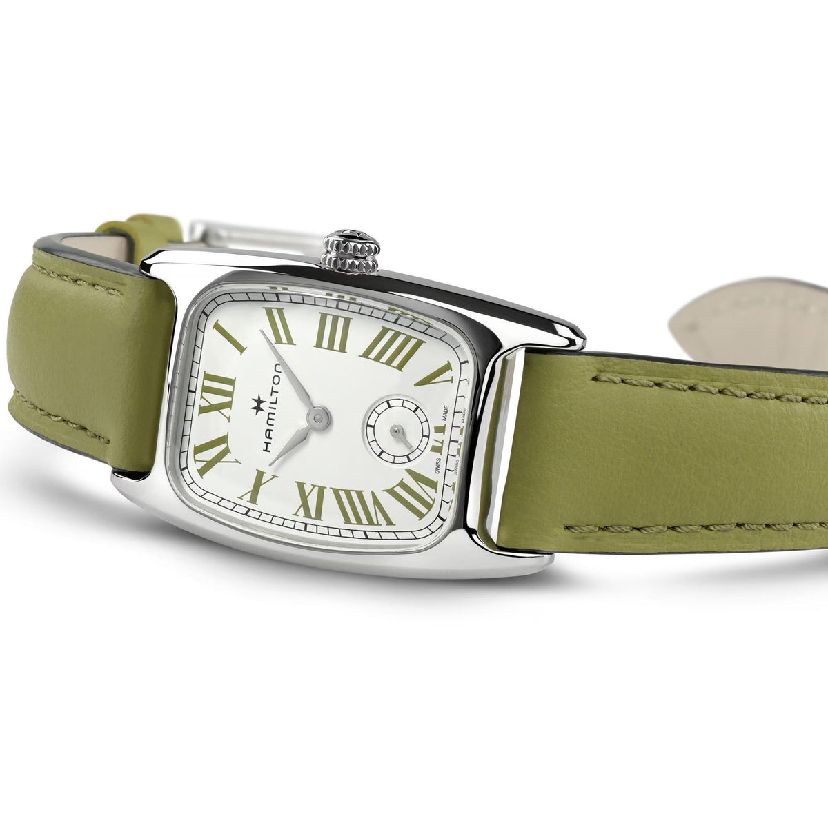 Women’s quartz wristwatch with white dial and olive green leather strap, curved silver case