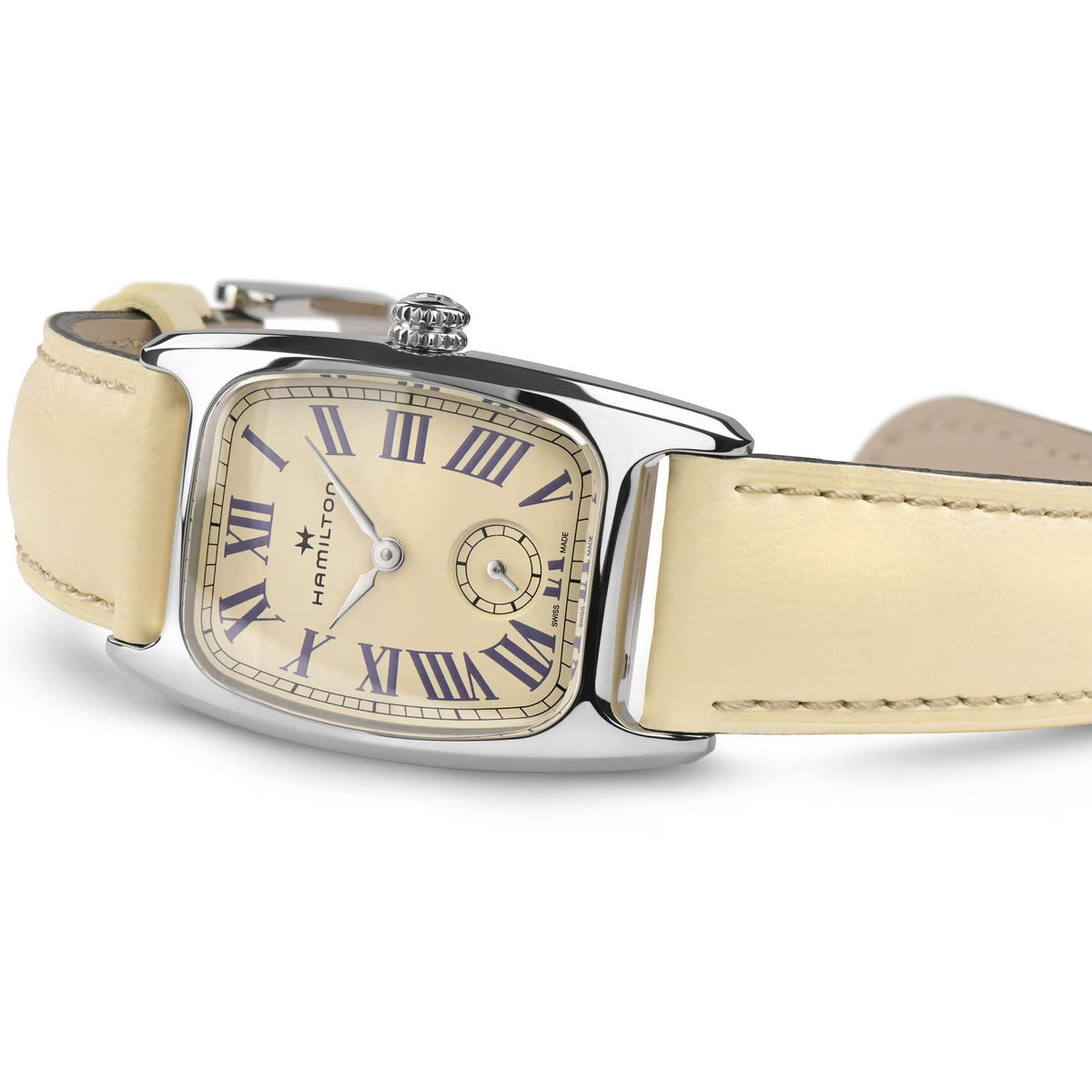 Rectangular silver watch case with beige leather strap and beige dial with Roman numerals
