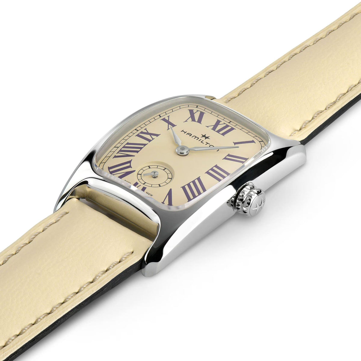 Beige leather strap ladies quartz watch with silver case and beige dial shown at an angle
