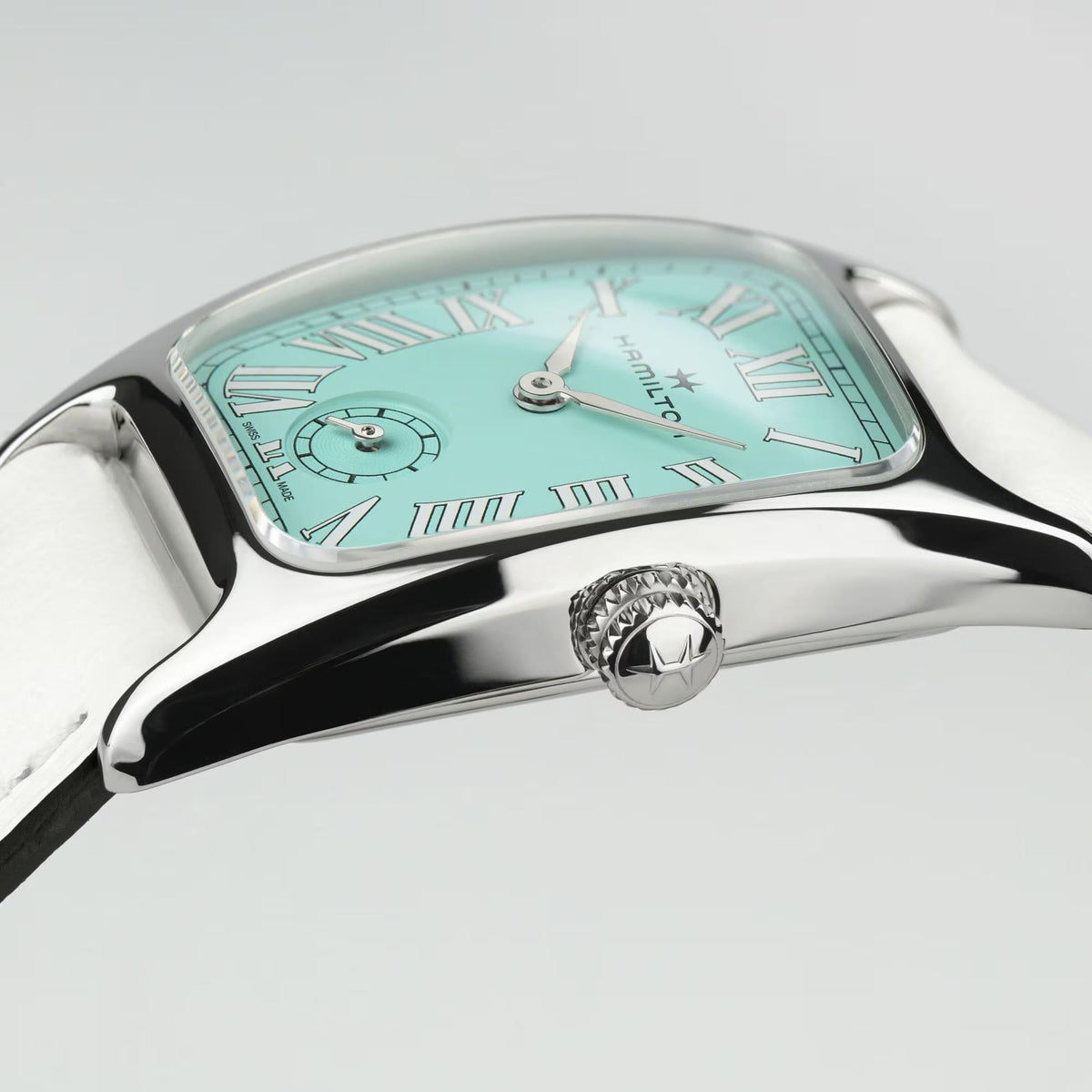 Close-up of green dial ladies quartz watch with Roman numerals and small seconds