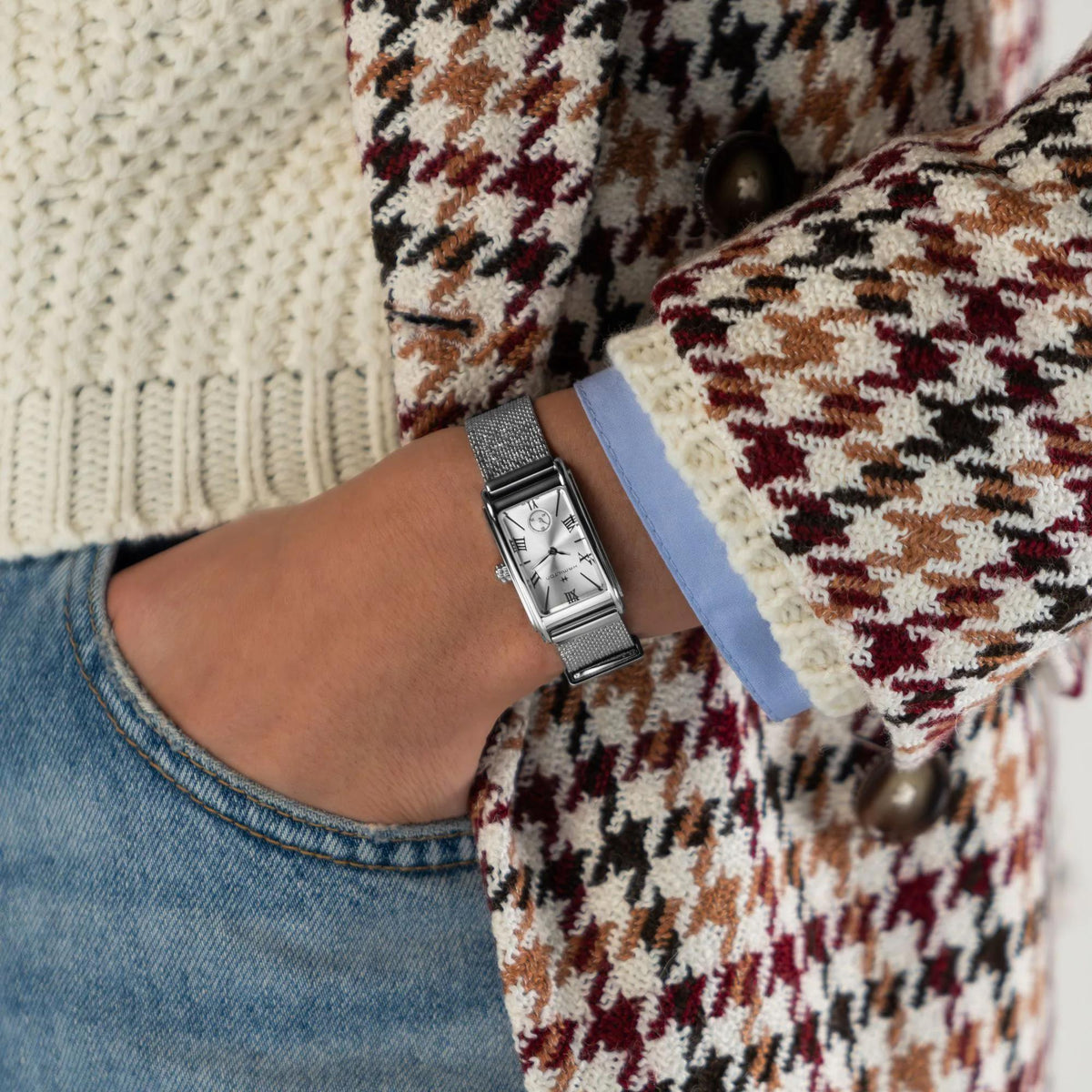 Hamilton ladies quartz watch on wrist with silver mesh band and silver rectangular face