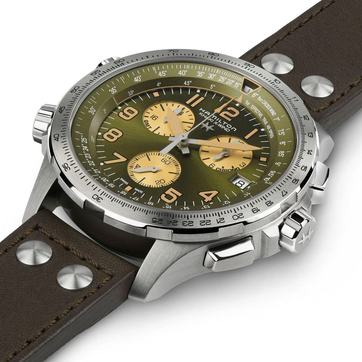 Green dial chronograph watch with brown leather strap and silver metal case from an angle