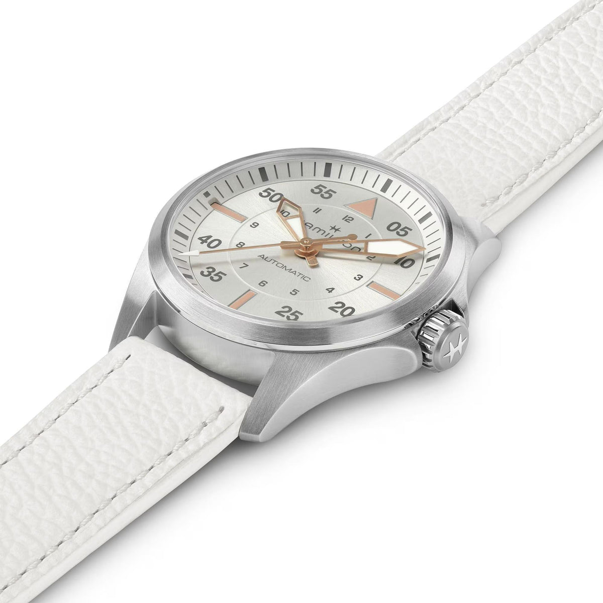 Silver pilot watch with white leather band, crown side view of light gray dial