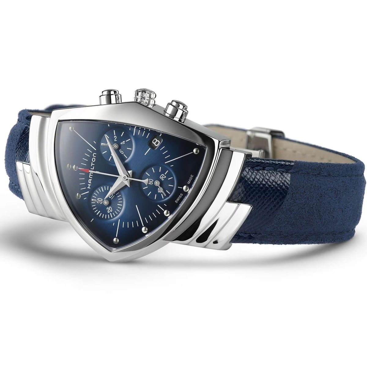 Angled close-up of a Hamilton Ventura Chronograph watch, stainless steel case, blue dial, and textured blue strap