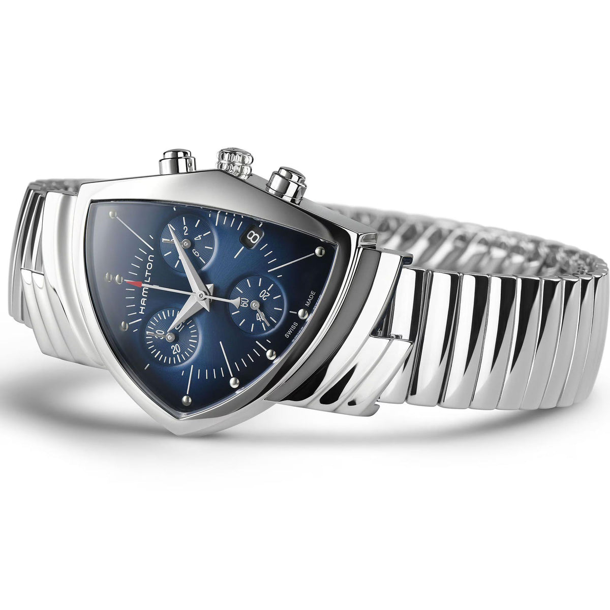 Steel ladies chronograph quartz watch with blue dial, subdials, and ribbed metal bracelet.