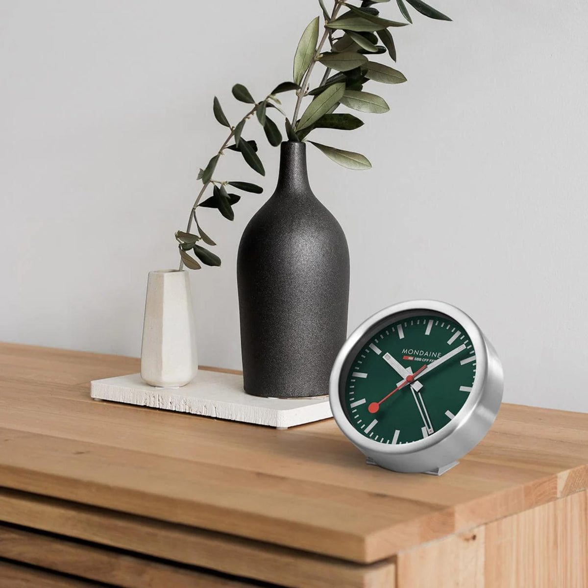 Green dial mini wall clock with silver frame, red second hand and baton markers