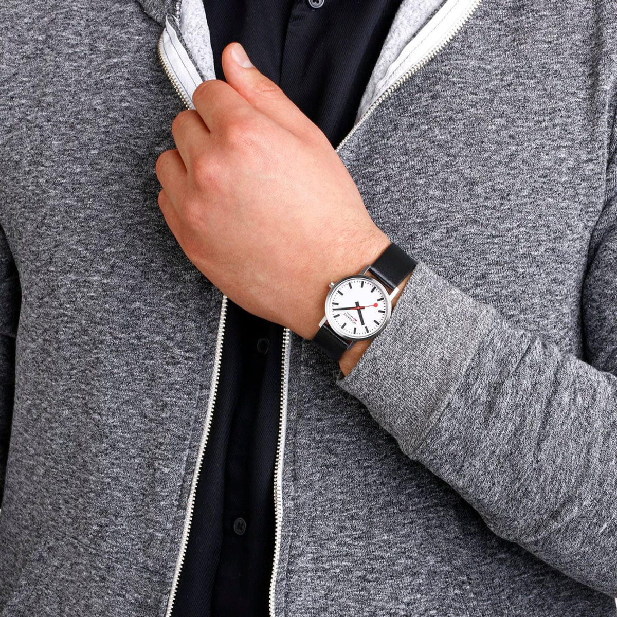 Mondaine Classic A660.30314.16SBBV casual timepiece worn on a wrist with a grey hoodie