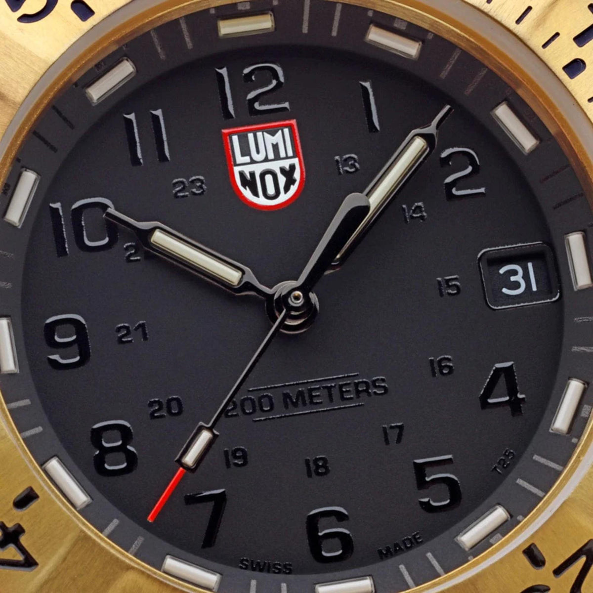 Close-up of Luminox watch dial with red Luminox logo, luminous numerals, and 31-day date