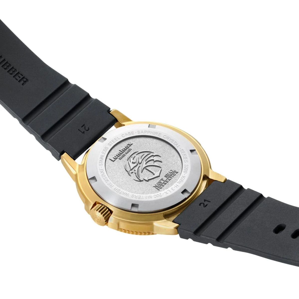 Luminox watch underside with engraved case back and black rubber strap with gold buckle