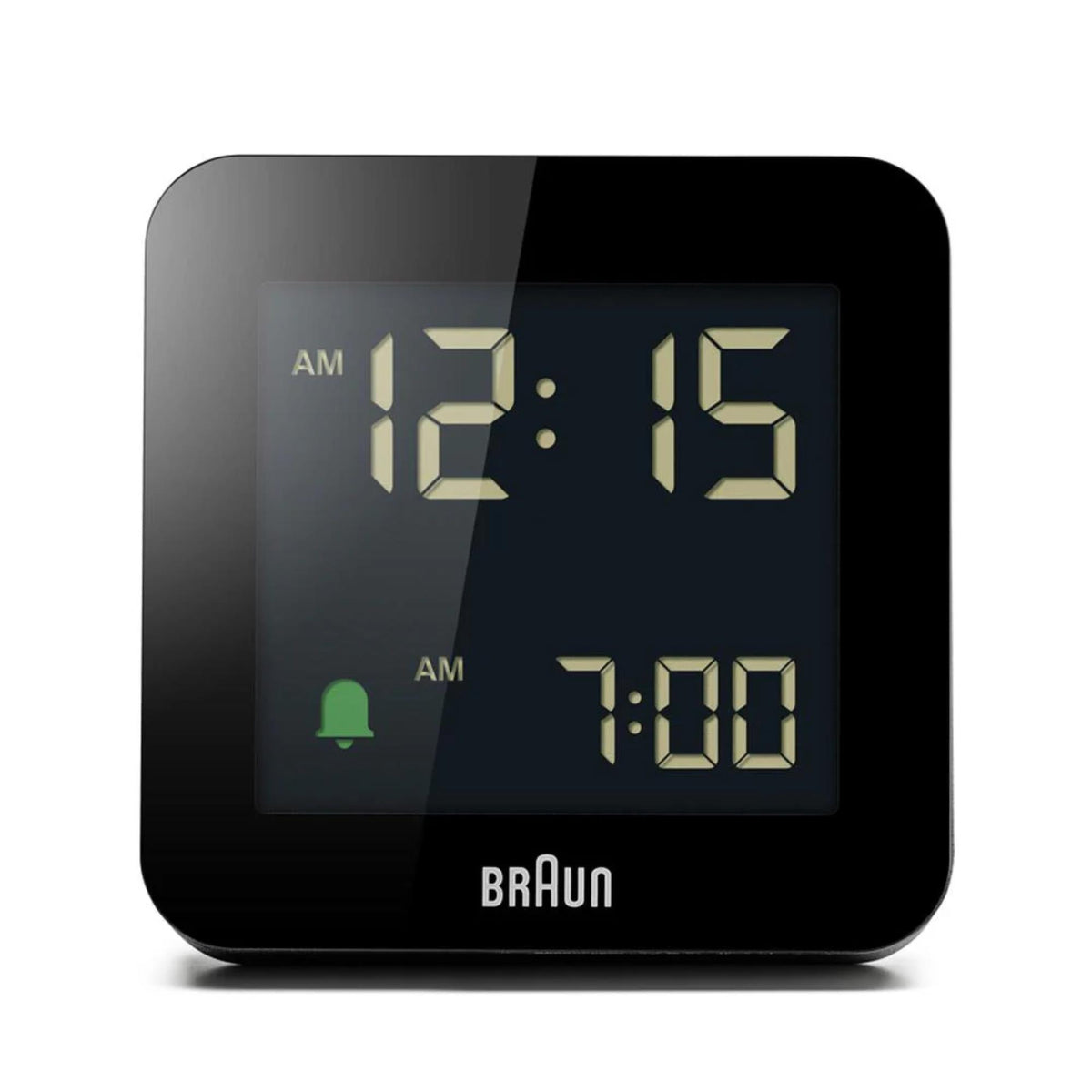 Black digital alarm clock front view with muted backlit display showing 12:15 and 7:00