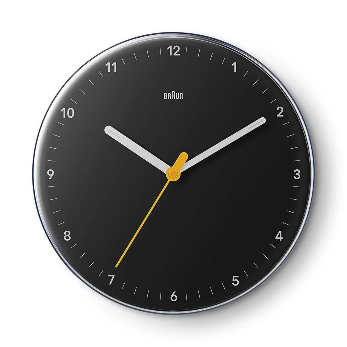 Black wall clock with chrome bezel, white minute markers, and yellow hour hand