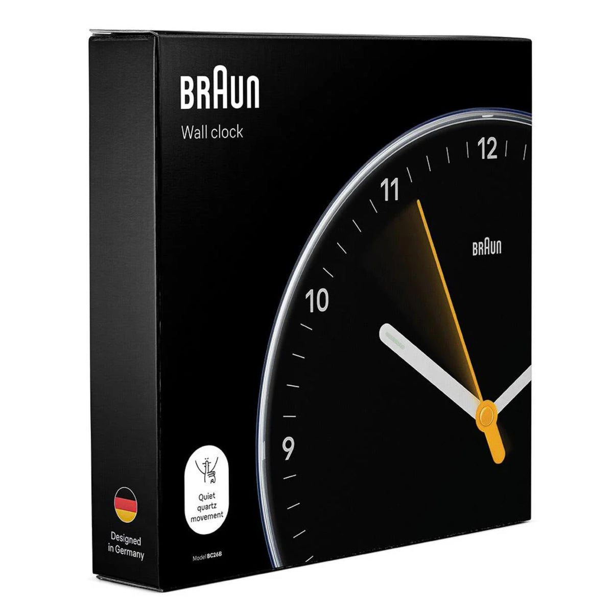 Braun wall clock retail box showing black dial and yellow hands