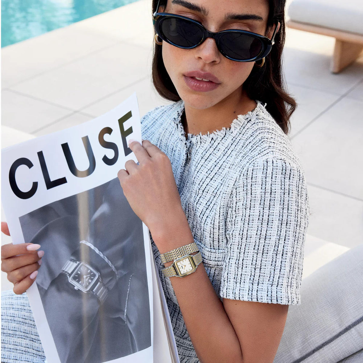Women's quartz watch with gold and silver metal mesh strap on wrist