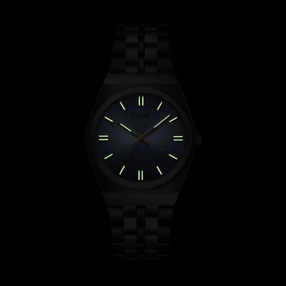 Women's dark dial watch with glowing green hour markers and steel bracelet