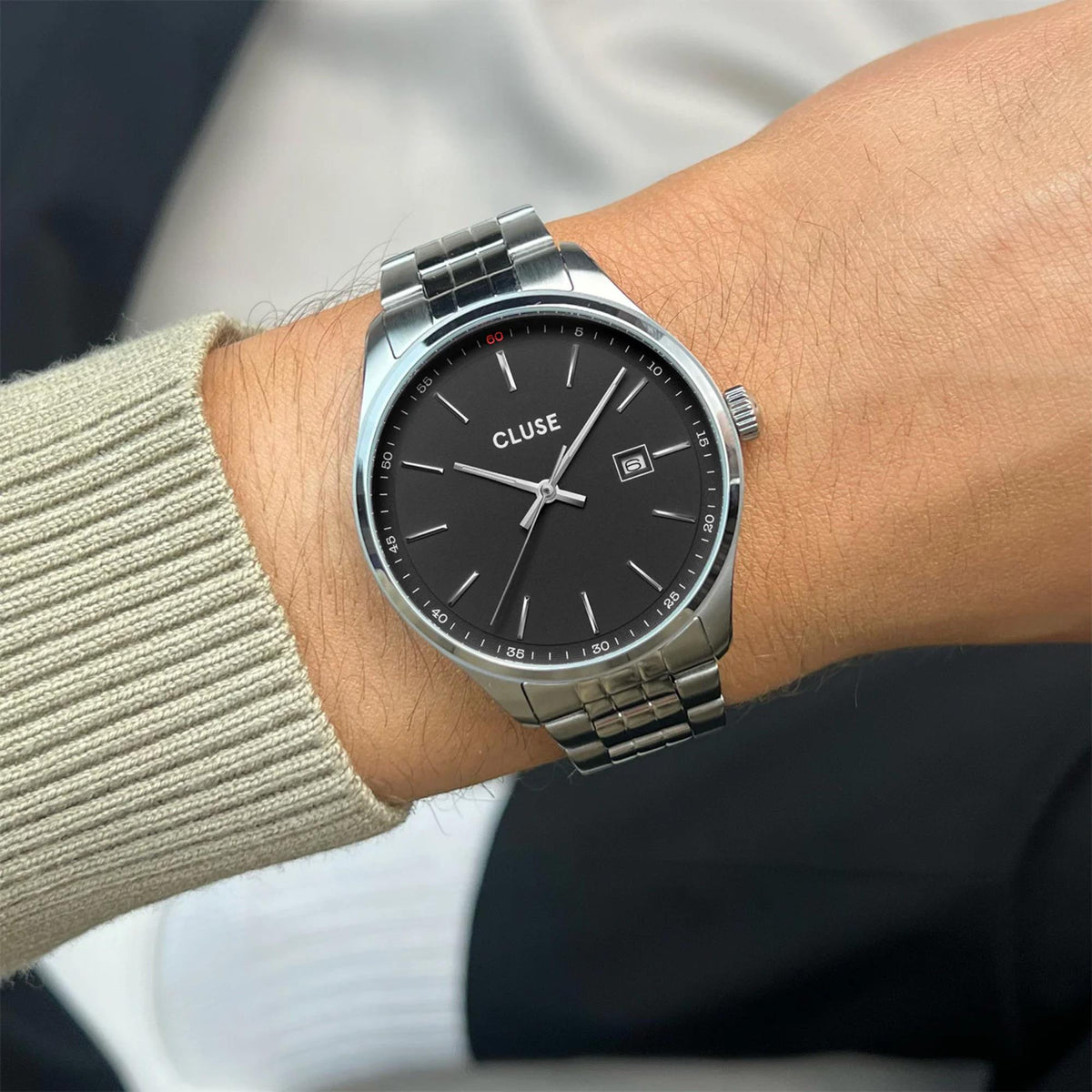 Men's steel wristwatch with black dial and silver link bracelet