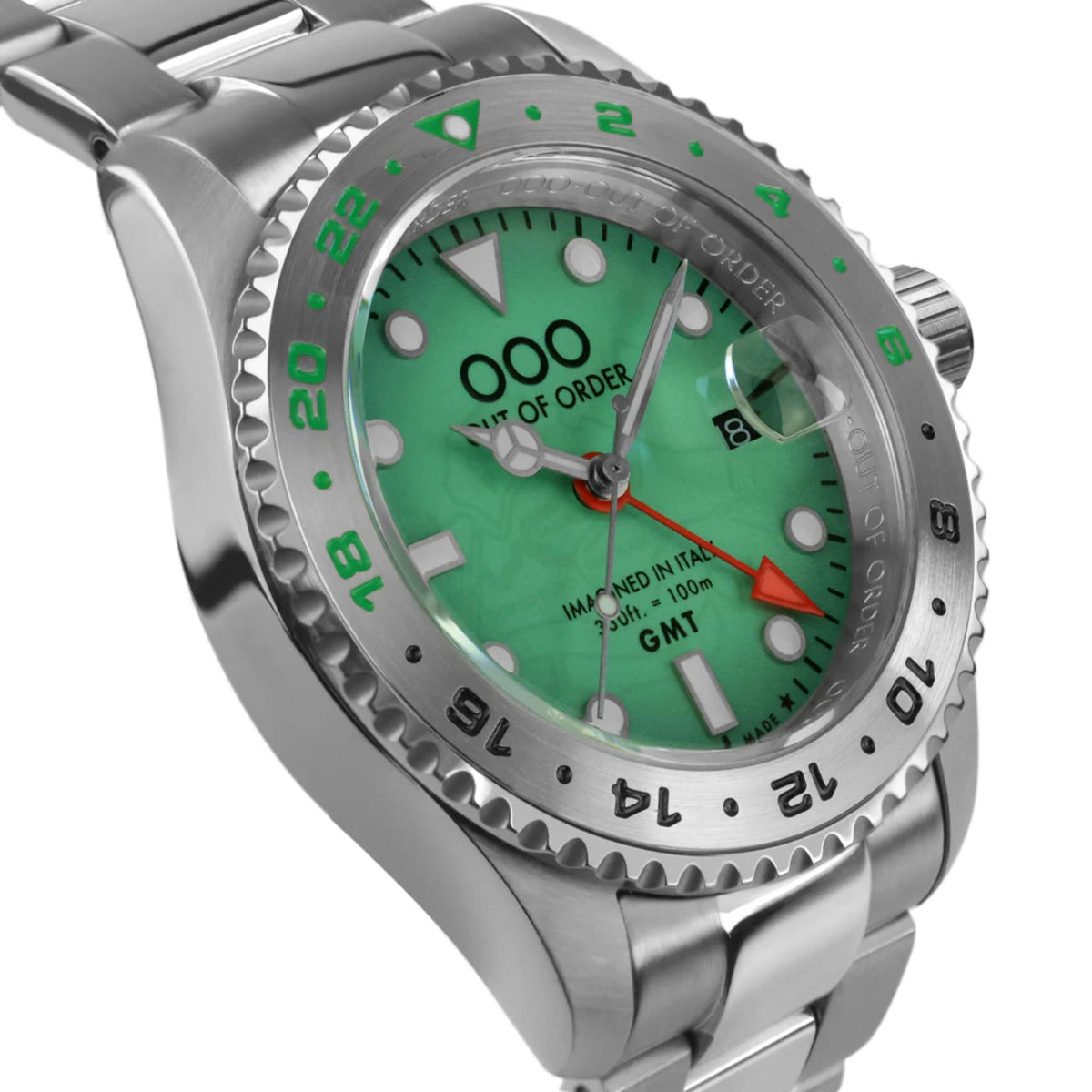 Men's GMT wristwatch close-up: stainless case, green dial, red GMT hand, green bezel markers.