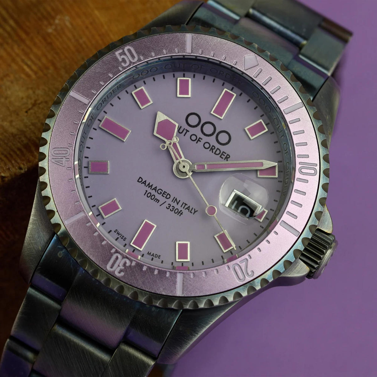 Men's distressed quartz watch with purple dial, pink hour markers, steel link strap