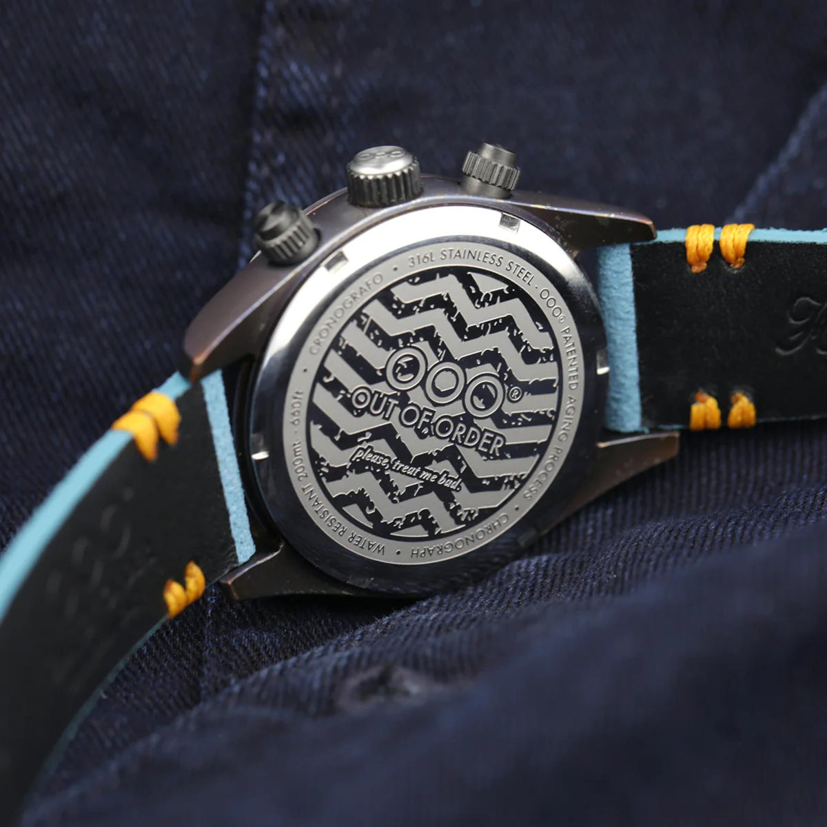 Men's chronograph quartz watch caseback with engraved logo and steel surround