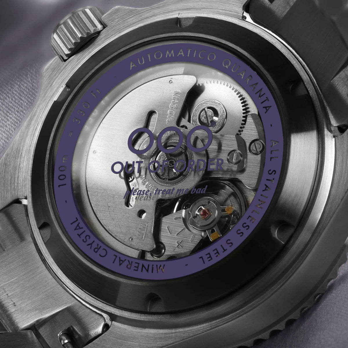 Automatic men's watch caseback showing mechanical movement under the clear glass