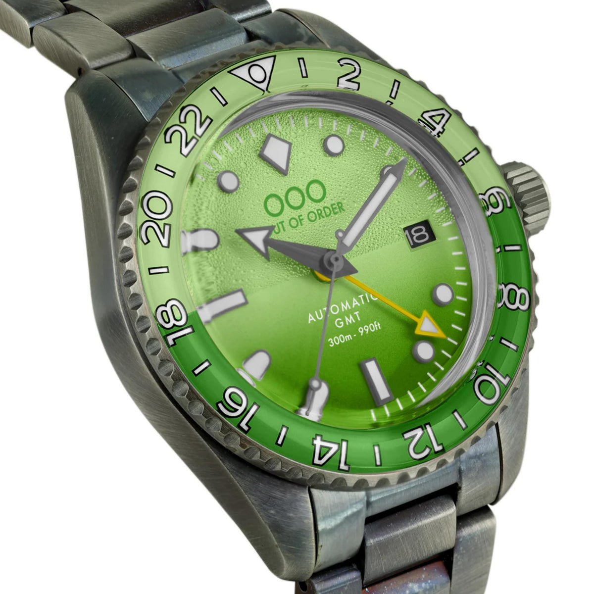Men's automatic GMT wristwatch with vivid green textured dial, silver case, and steel bracelet