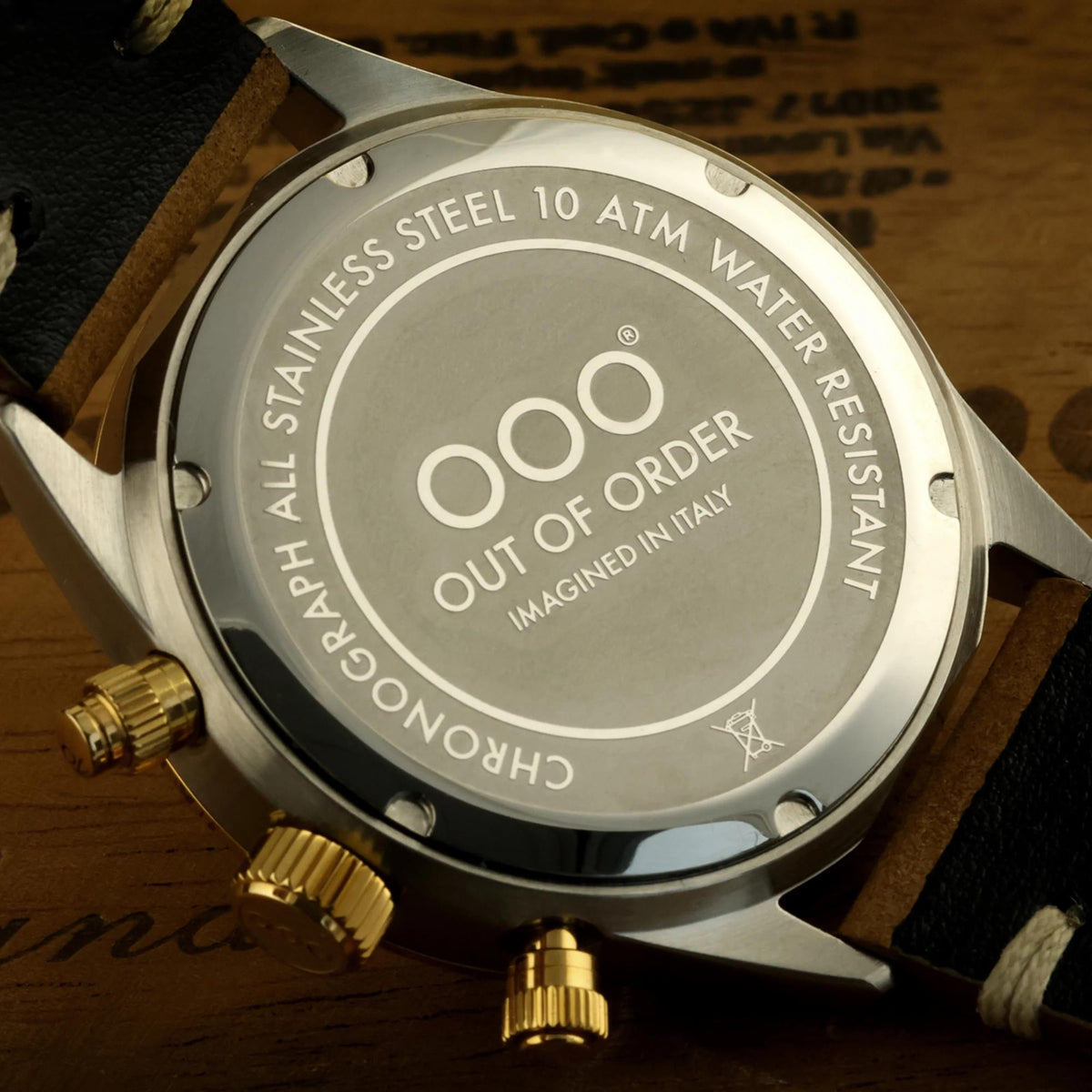 Stainless steel chronograph caseback with water-resistance engraving on black leather strap