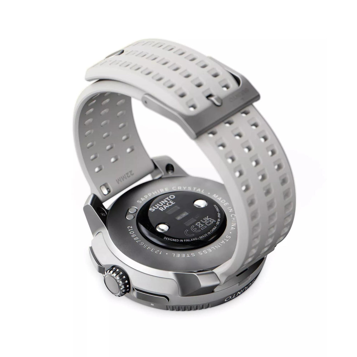 The engraved back case branding and sensor layout of the Suunto Race smart watch
