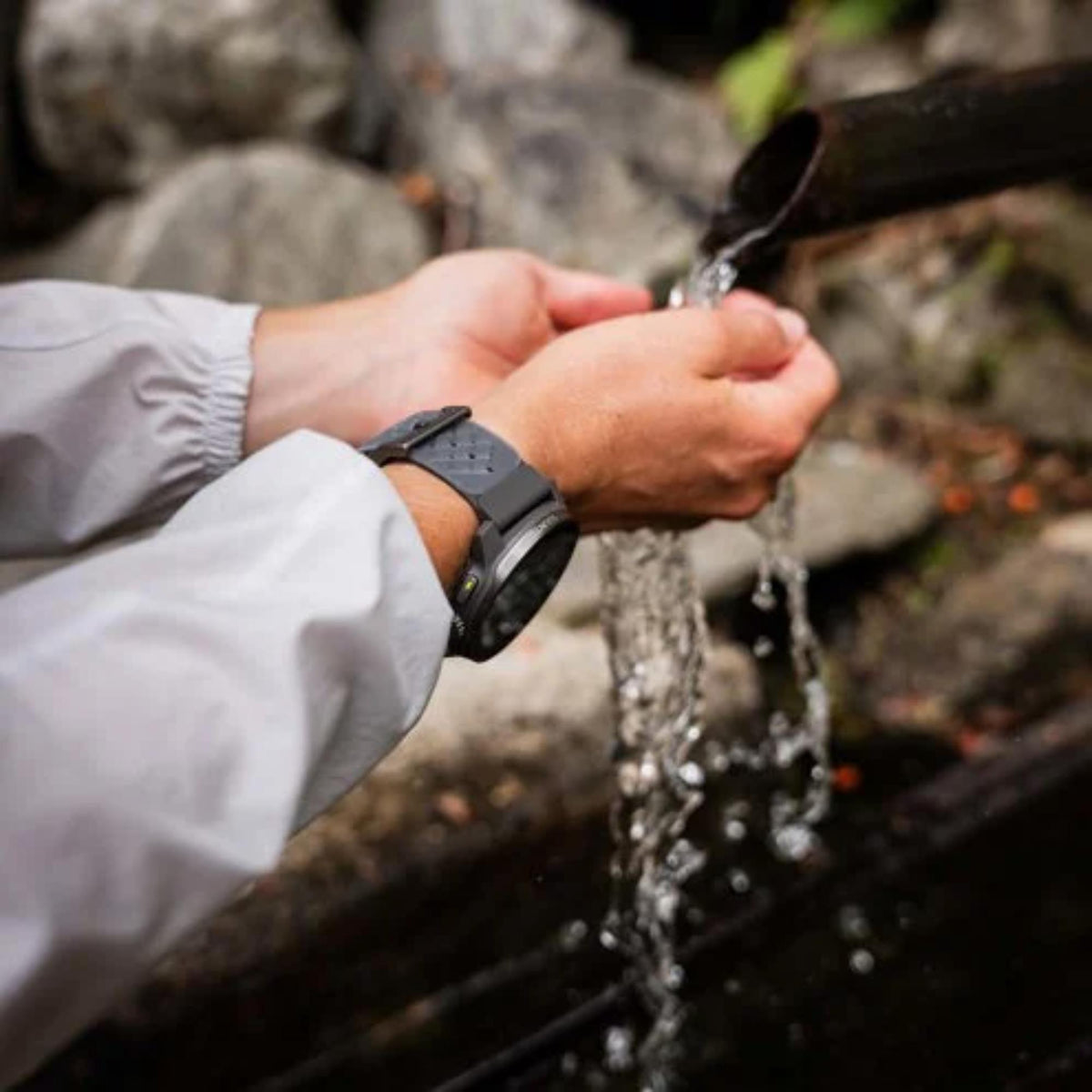 A person wearing the Suunto SS051104000 Race S digital smart fitness watch 