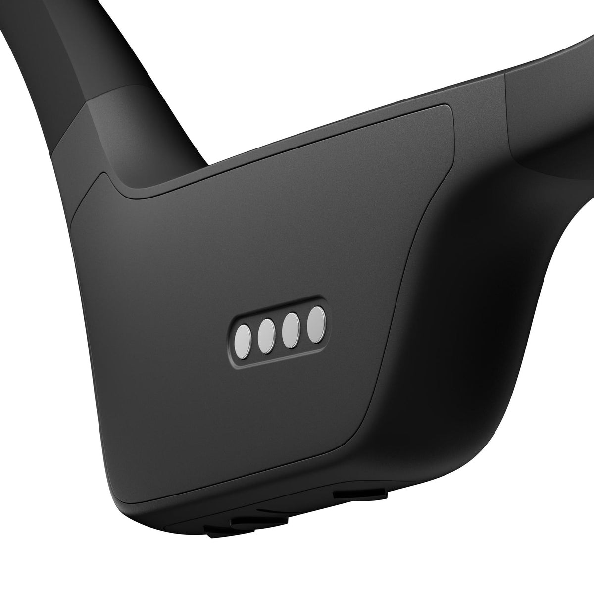Suunto Aqua SS051023000 black sports open-ear wireless headphones extreme close-up showing four metallic magnetic charging pins