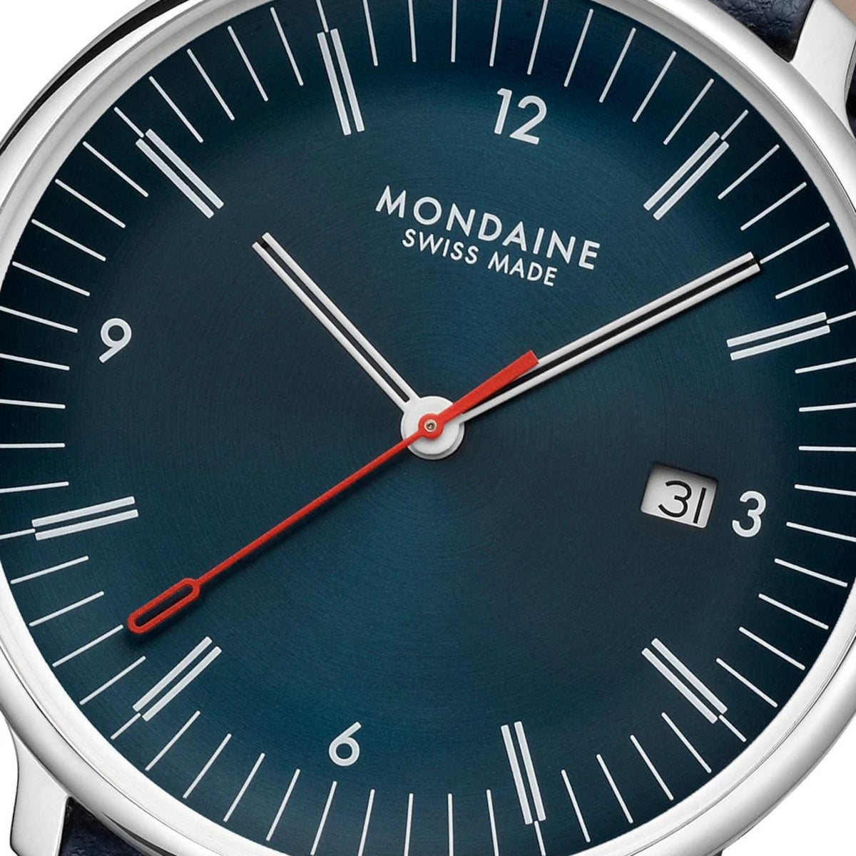 Mondaine Doppio MLE.41240.LQV.SET blue dial close up with white markers and date display