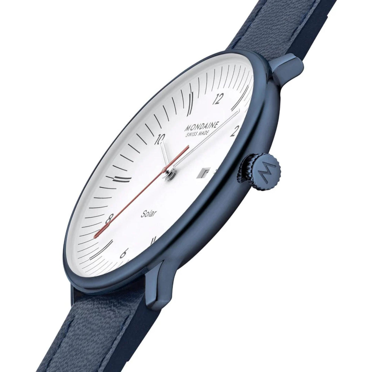 Side profile view of the Mondaine watch at an angle against a white background, showcasing the slim blue case, the crown engraved with the 'M' logo, and the blue textured leather strap extending outward