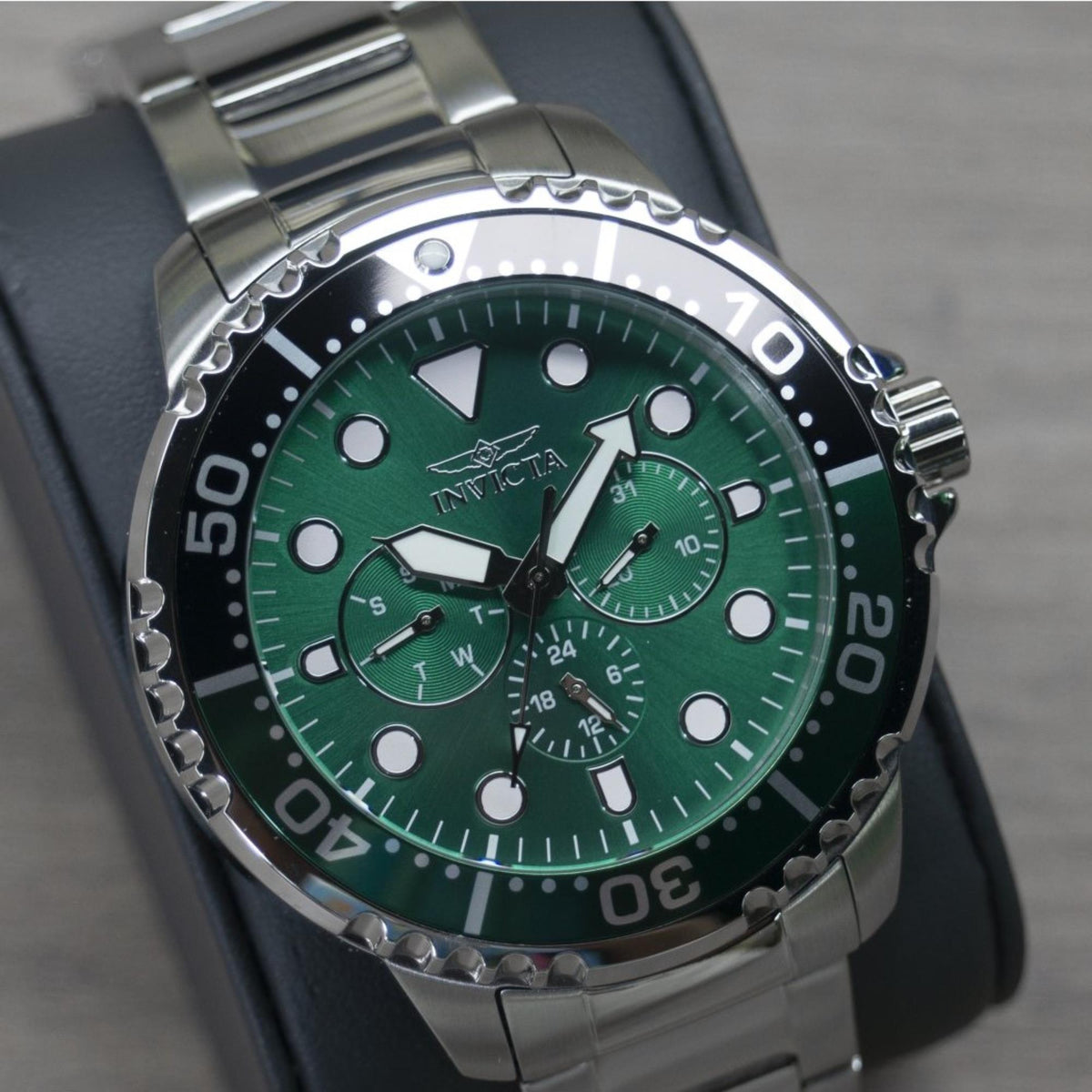 Men's Invicta pro diver watch with green dial, steel case, black strap and bezel markers