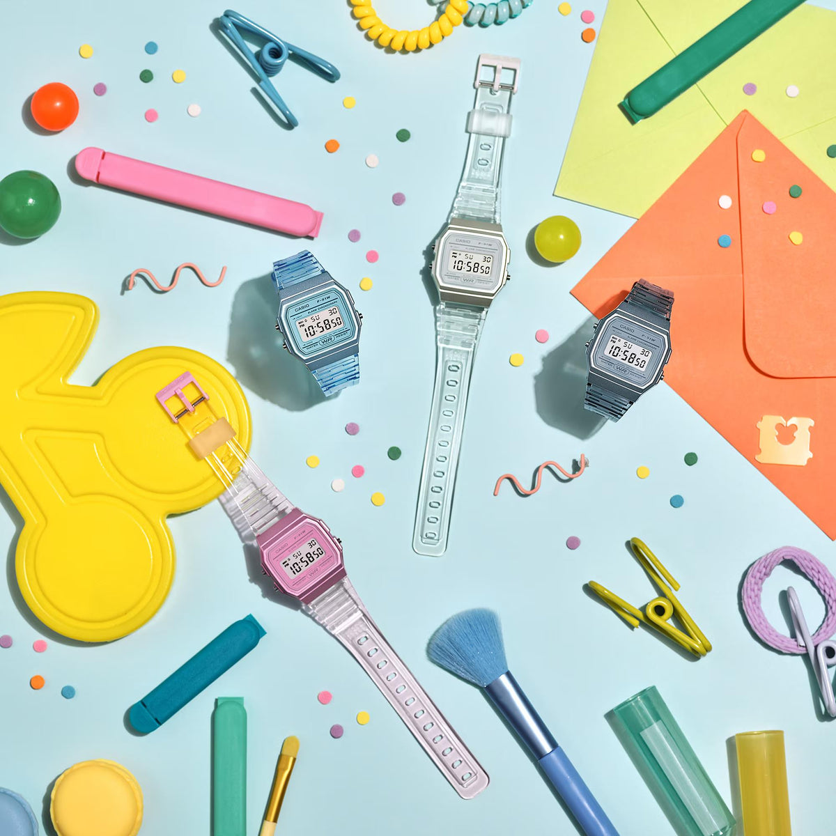 Casio digital quartz watch with clear resin strap and LCD face among accessories