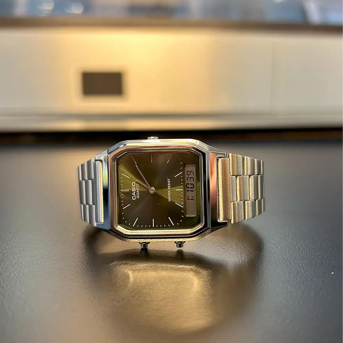 Square green dial Casio quartz watch with stainless steel bracelet, front view