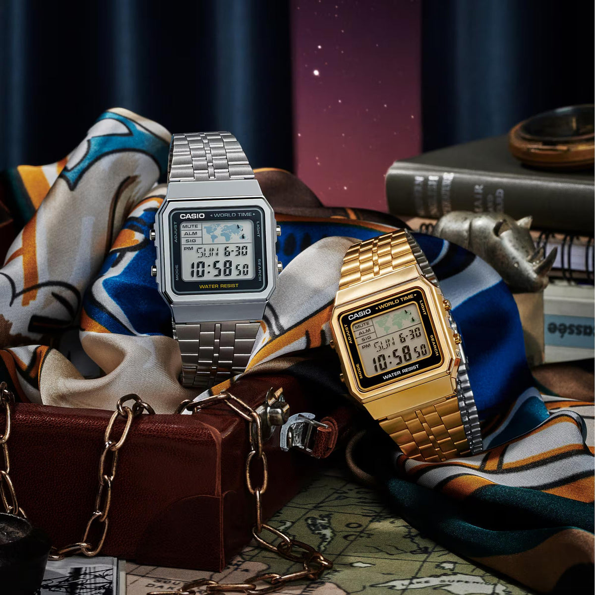 Lifestyle display featuring the silver Casio Vintage Digital Steel Strap Watch A500WEA-1EF next to a gold edition model