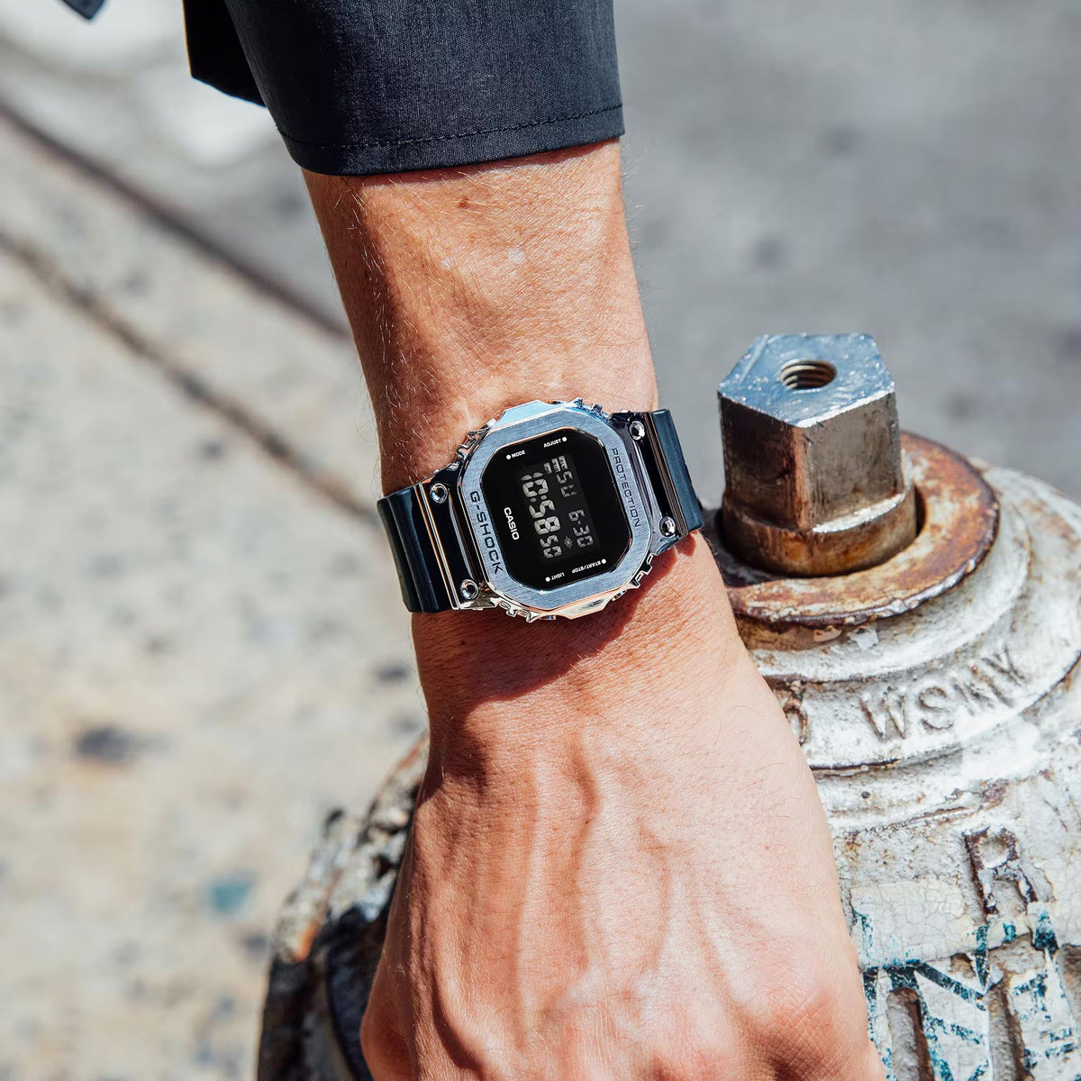 Men's digital G-Shock wristwatch with dark resin strap and black square display