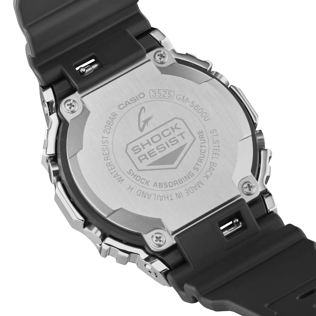 G-Shock watch underside with engraved case text and black resin strap