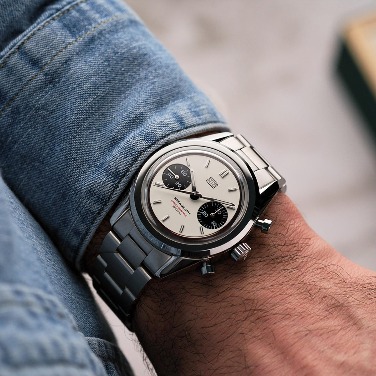 Men's steel chronograph watch, cream dial with black subdials, on wrist