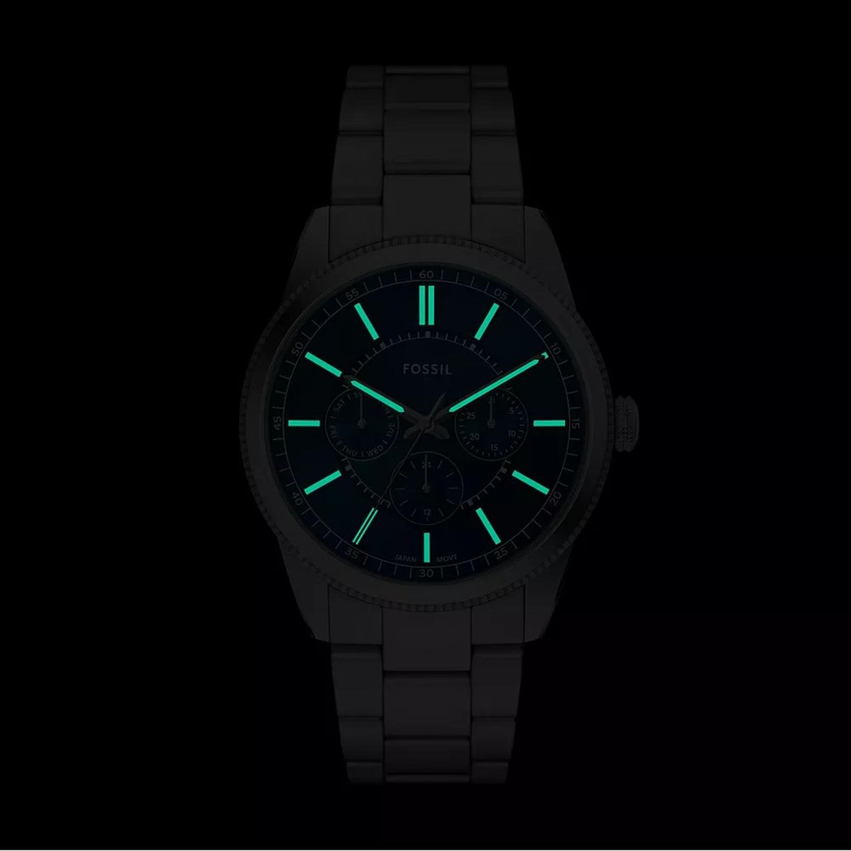 Fossil Pearson FS6134 front view displaying luminous hands and hour markers in dark lighting