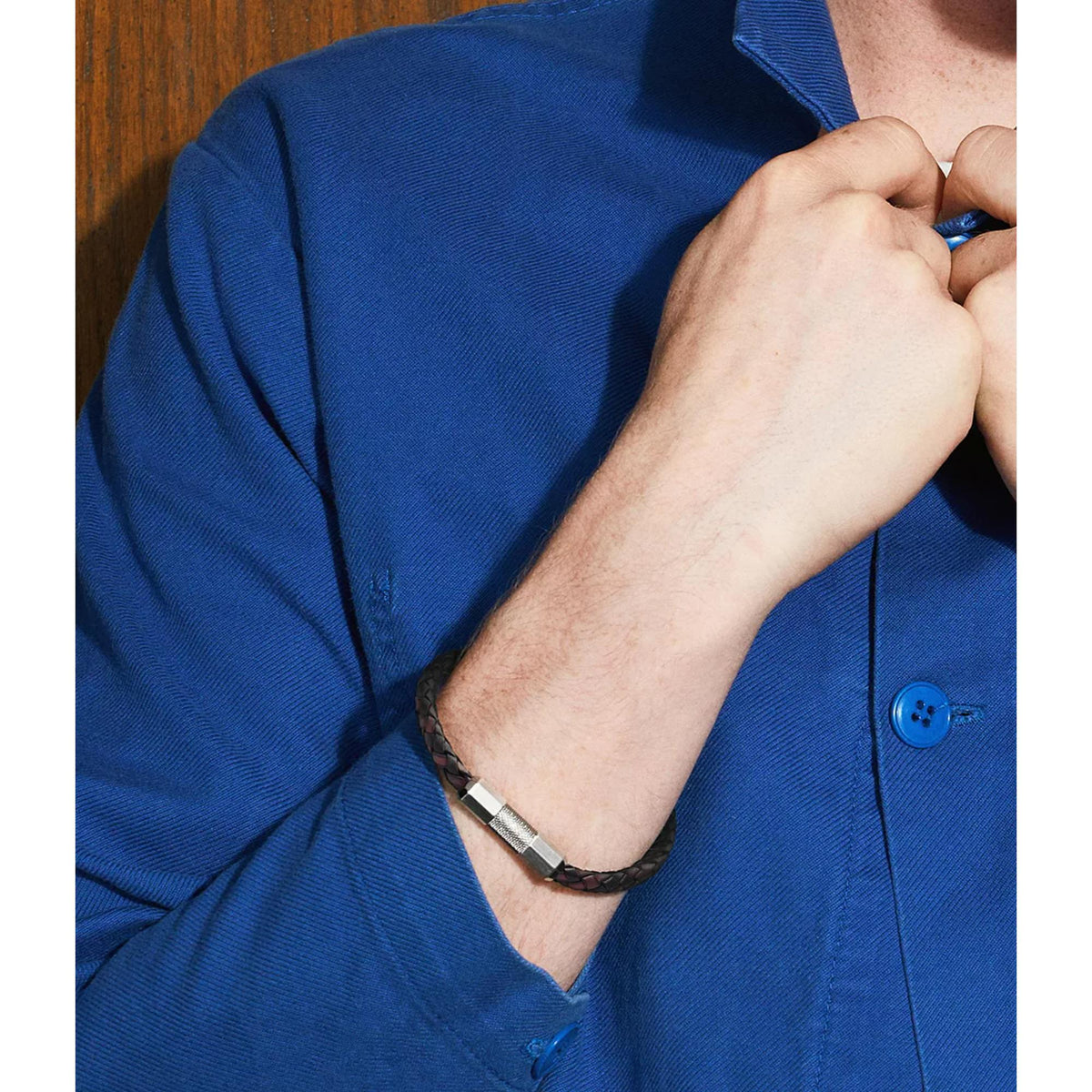 Men's leather bracelet with black-and-burgundy braided strap and silver-tone clasp