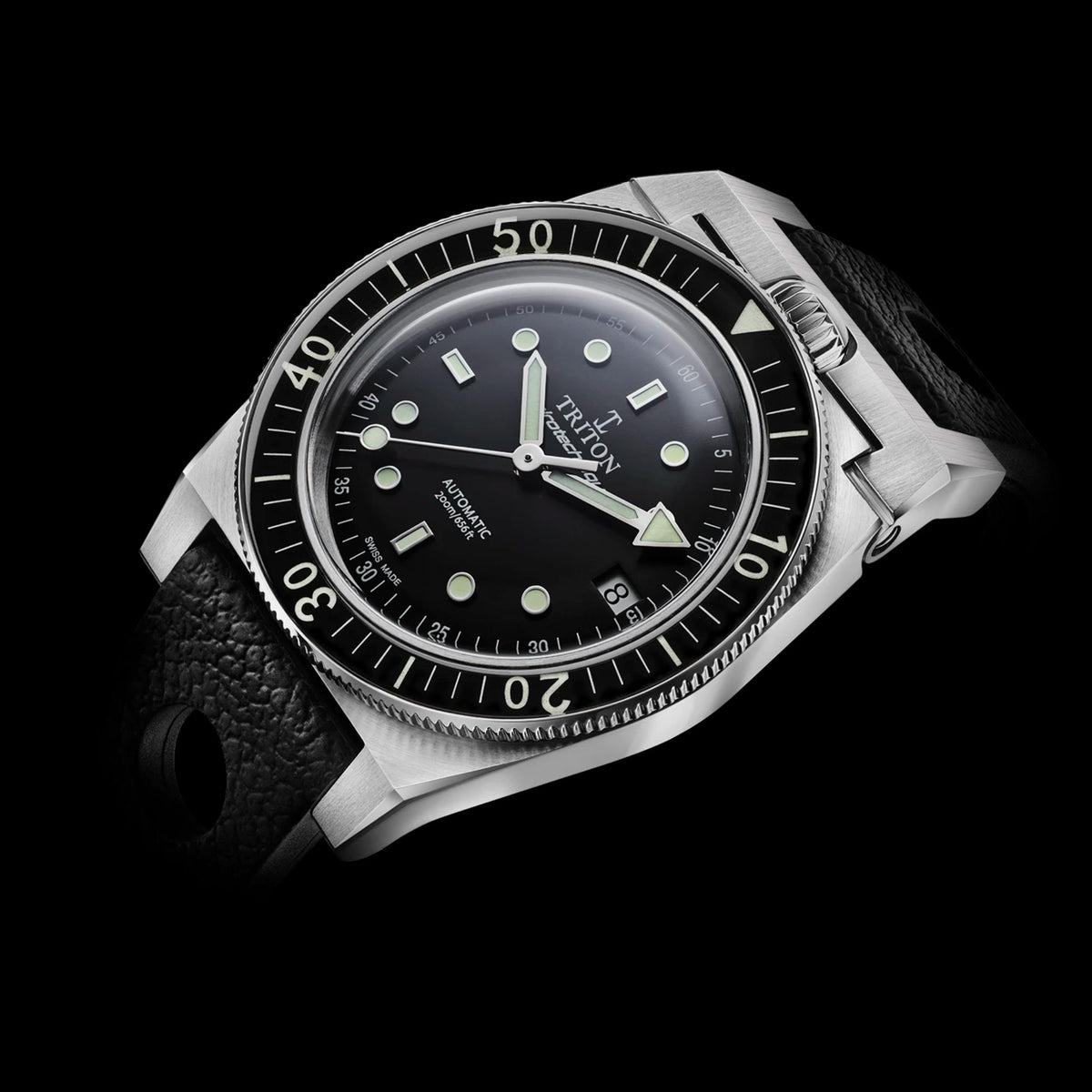 Men's dive watch with dark dial, luminous markers and hands, steel case, black rubber strap.