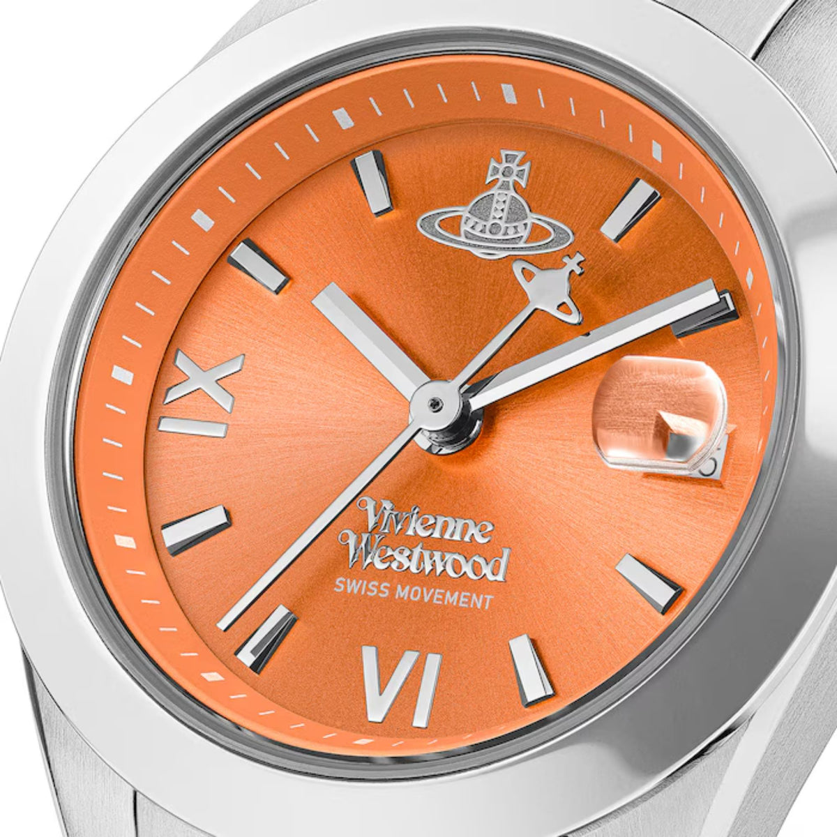 Close-up of orange watch dial with silver hands, markers, and Vivienne Westwood details