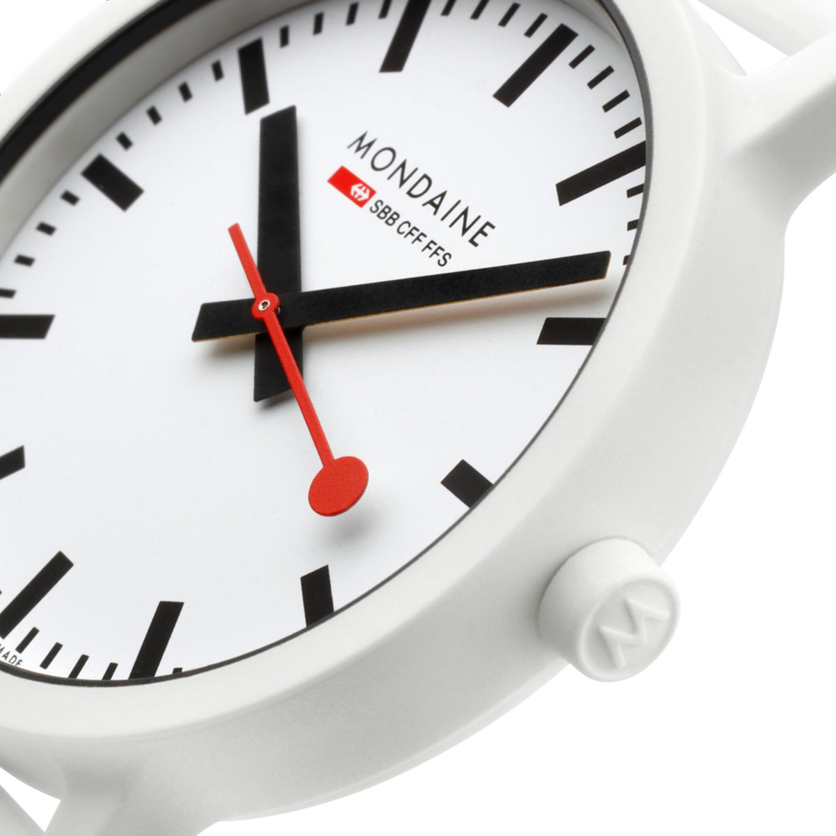 Mondaine Essence watch face closeup: white dial, black indices, red hands