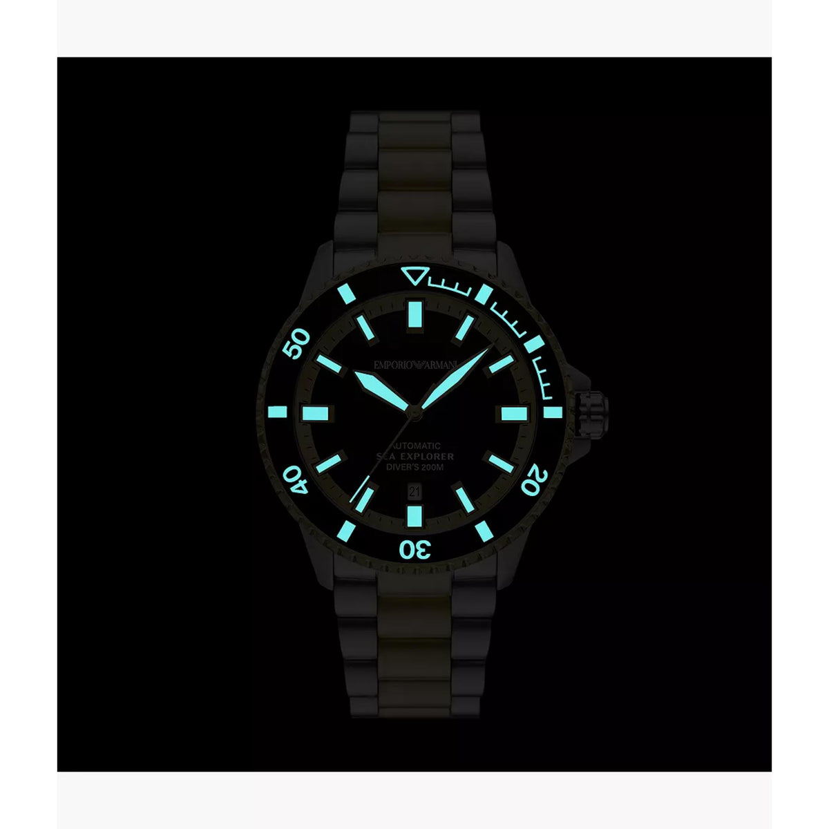 Dark view displaying glowing luminescent hands, index markers, and bezel pip on the Emporio Armani Sea Explorer AR60089 timepiece