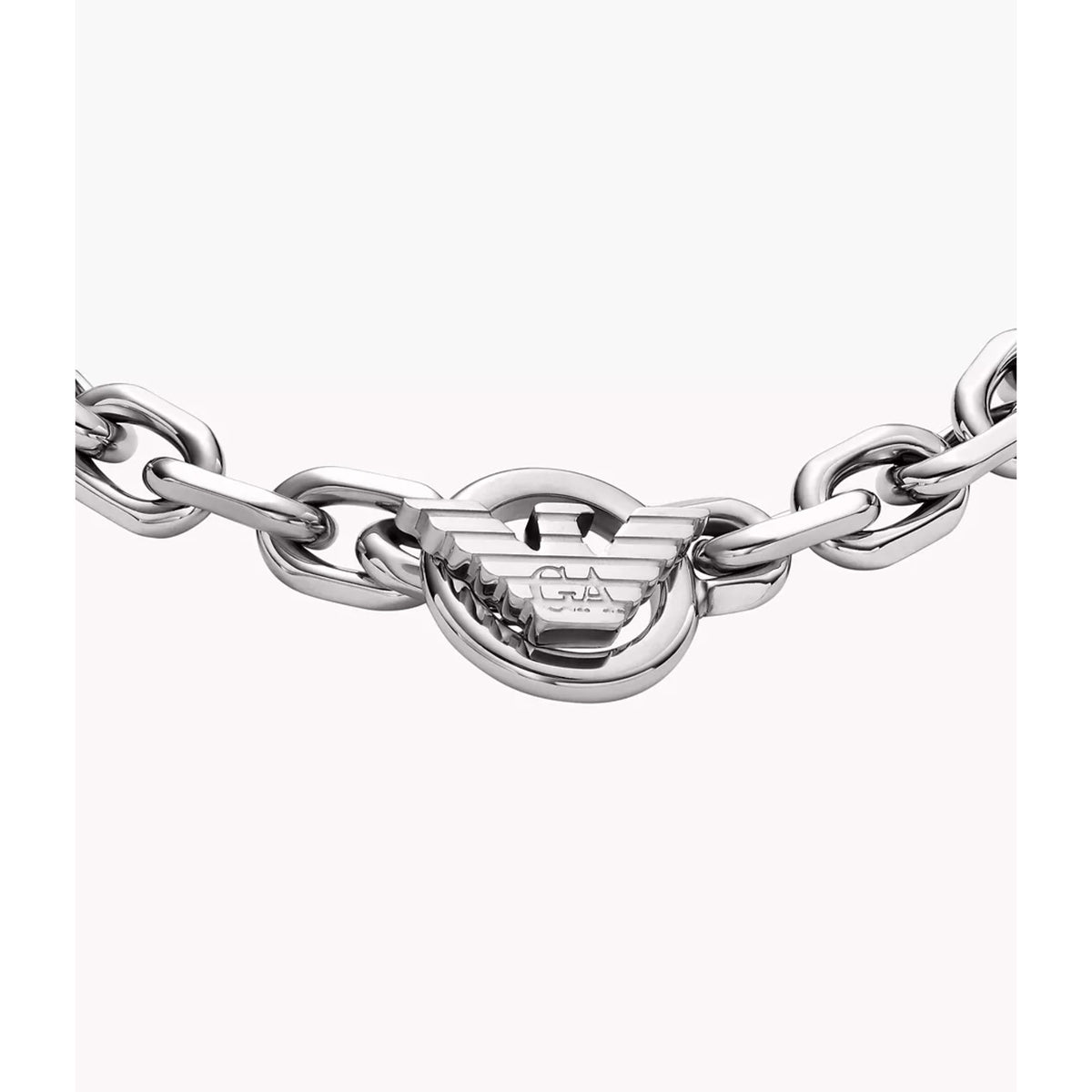 Close-up view of central eagle logo charm on Emporio Armani mens stainless steel ID link bracelet EGS3236040
