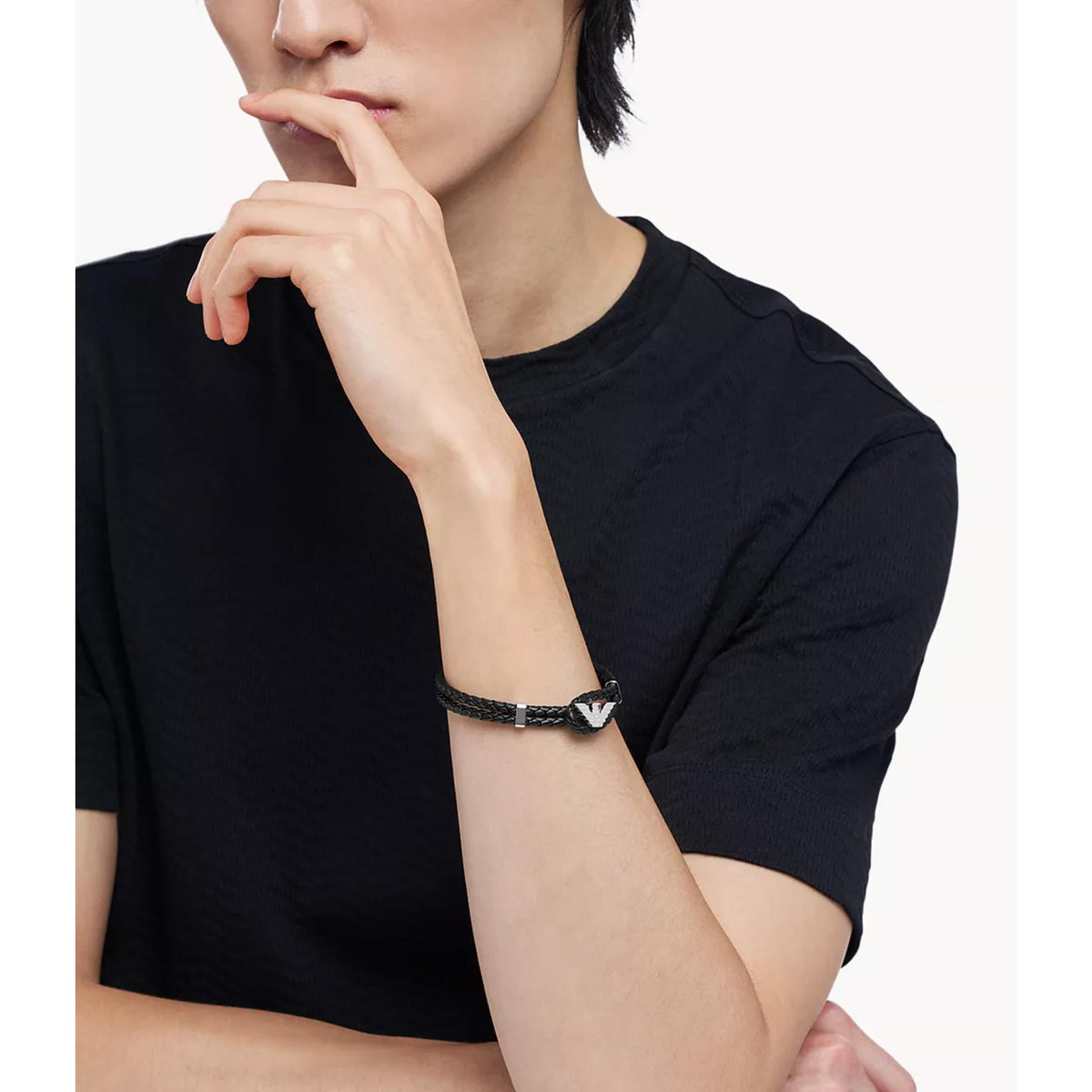 Model wearing Emporio Armani mens braided black leather bracelet EGS3237040 on wrist