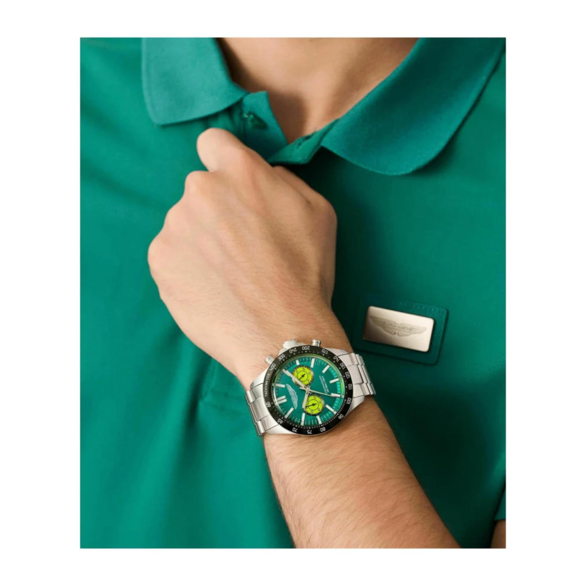 Aston Martin quartz chronograph watch worn on wrist with vibrant green dial and elegant RSST steel bracelet