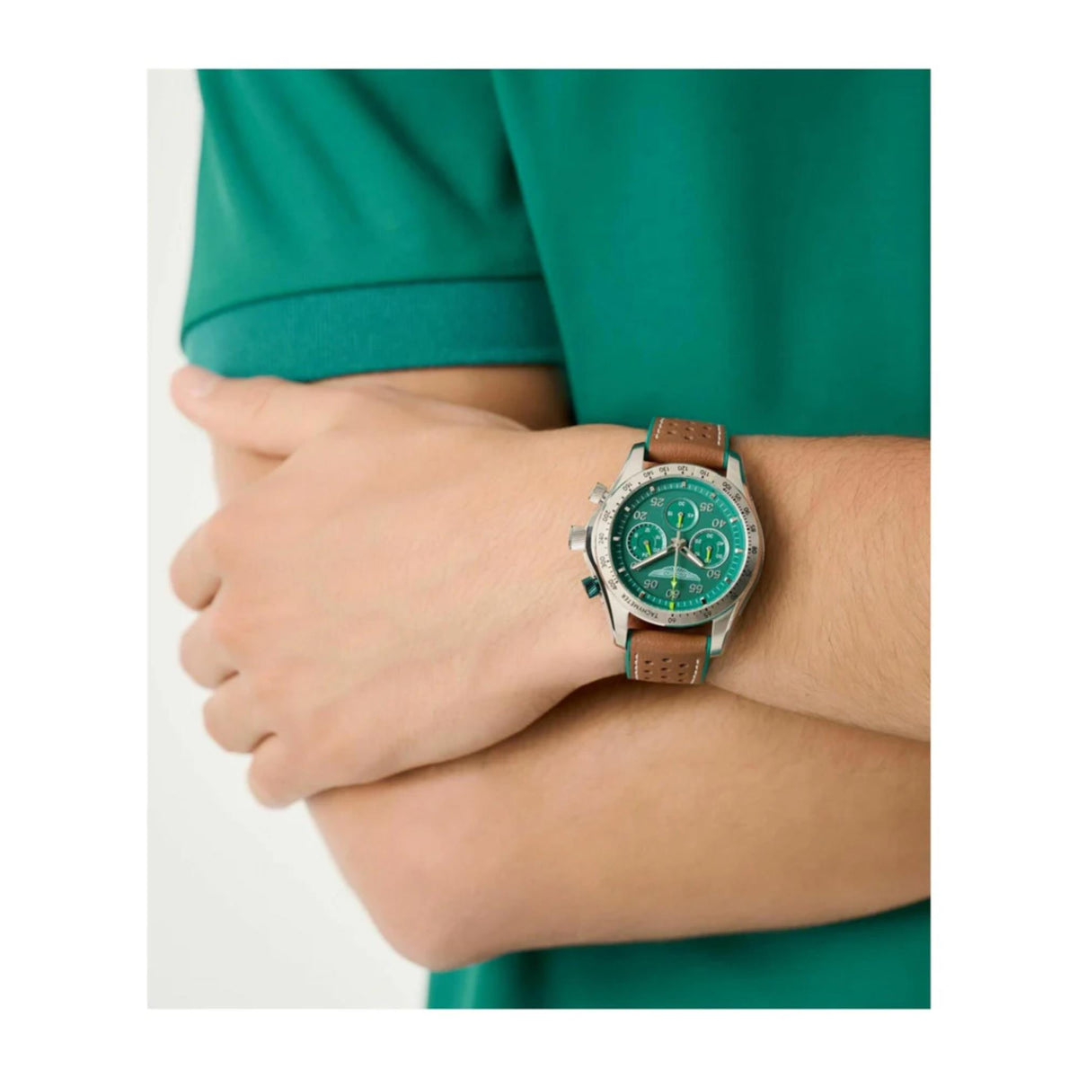 Aston Martin quartz chronograph watch on wrist with green dial and leather strap